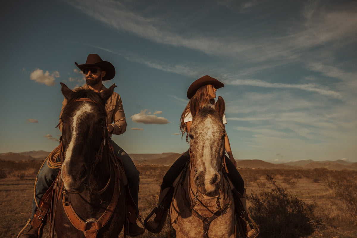A rider in a Tailor Hats cowboy hat at golden hour